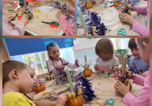 Dzieci tworzą jesienne dekoracje z małych dyń, suszonych roślin i świec podczas warsztatów plastycznych przy stole.